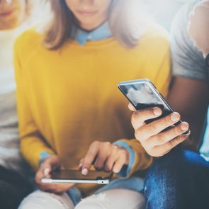 group of people taking quiz on smart phones