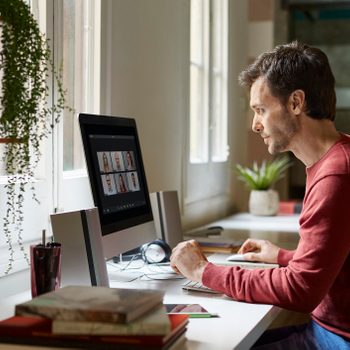 man in a virtual meeting working from home