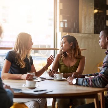 friends hanging out and chatting at a cafe