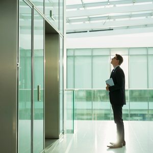 business man waiting for elevator