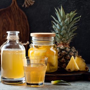 Fermented mexican pineapple Tepache. Homemade raw kombucha tea with pineapple. Healthy natural probiotic flavored drink.