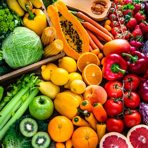 Healthy fresh rainbow colored fruits and vegetables background